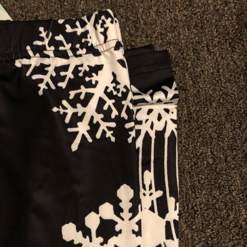 Black leggings with white snowflakes